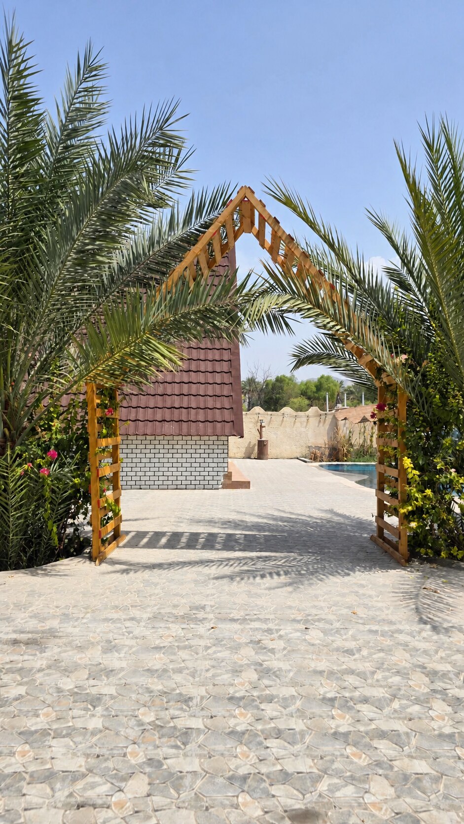 Palm-framed entrance to the Family Retreat