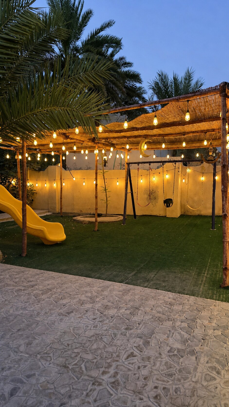 Illuminated family garden with children's play area