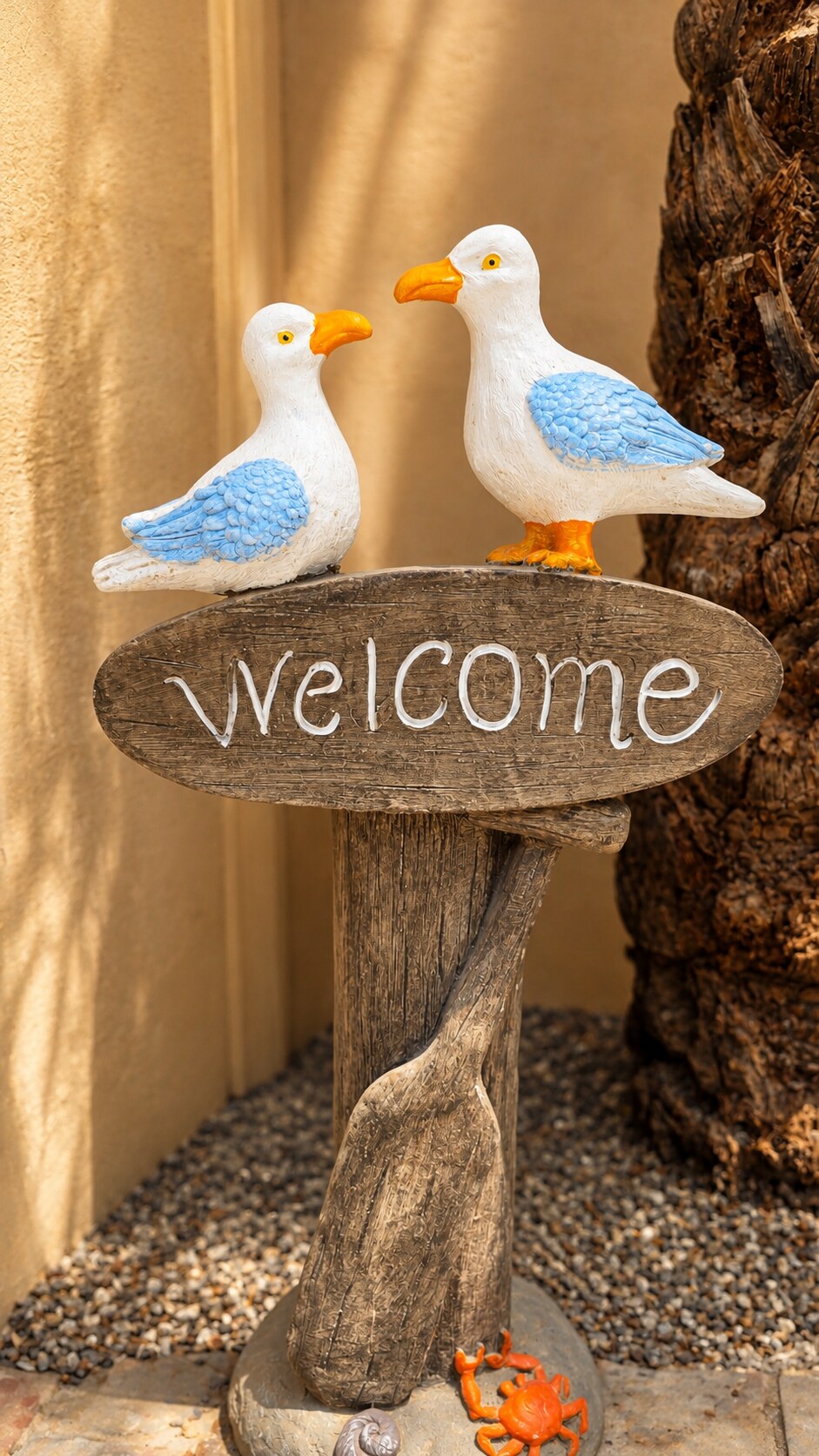 Bird welcome sculpture in the Romantic Cottage garden